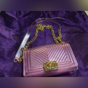 JELLY CLEAR PURSE WITH ADJUSTABLE/REMOVABLE GOLD CHAIN.